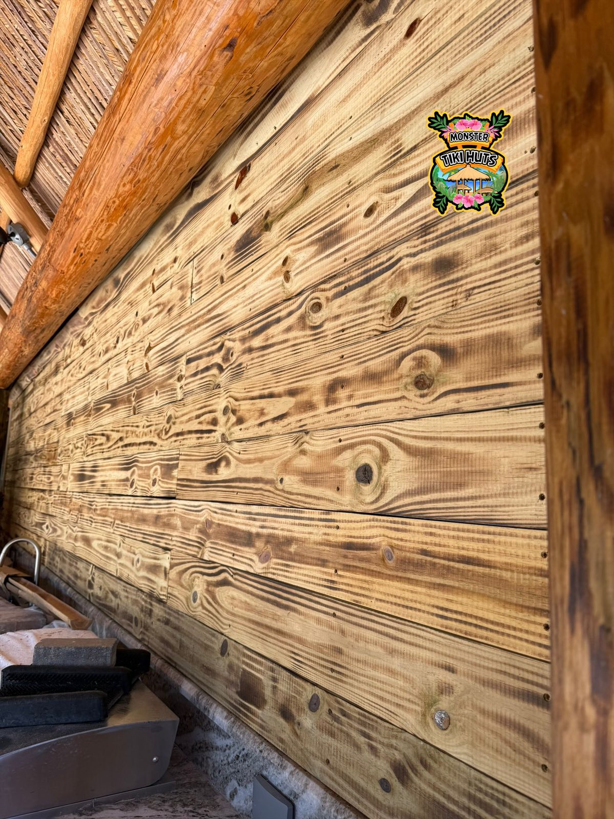 Privacy wall on one side of a tiki hut — bamboo screening