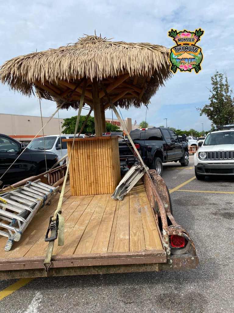 Mobile tiki bar with synthetic thatch on a trailer
