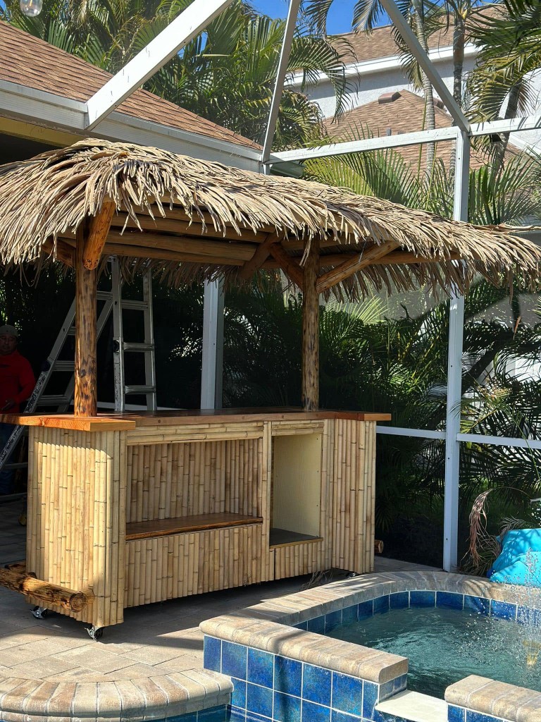 Portable poolside tiki bar with synthetic thatch