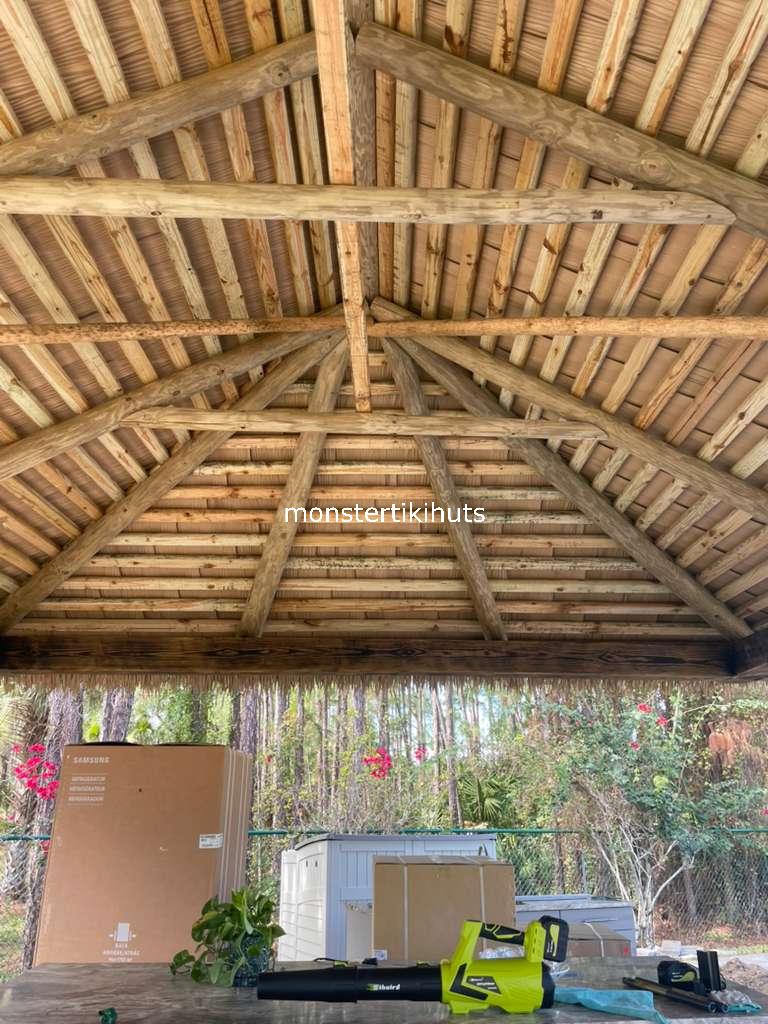Synthetic thatch interior ceiling with wooden rafter framework